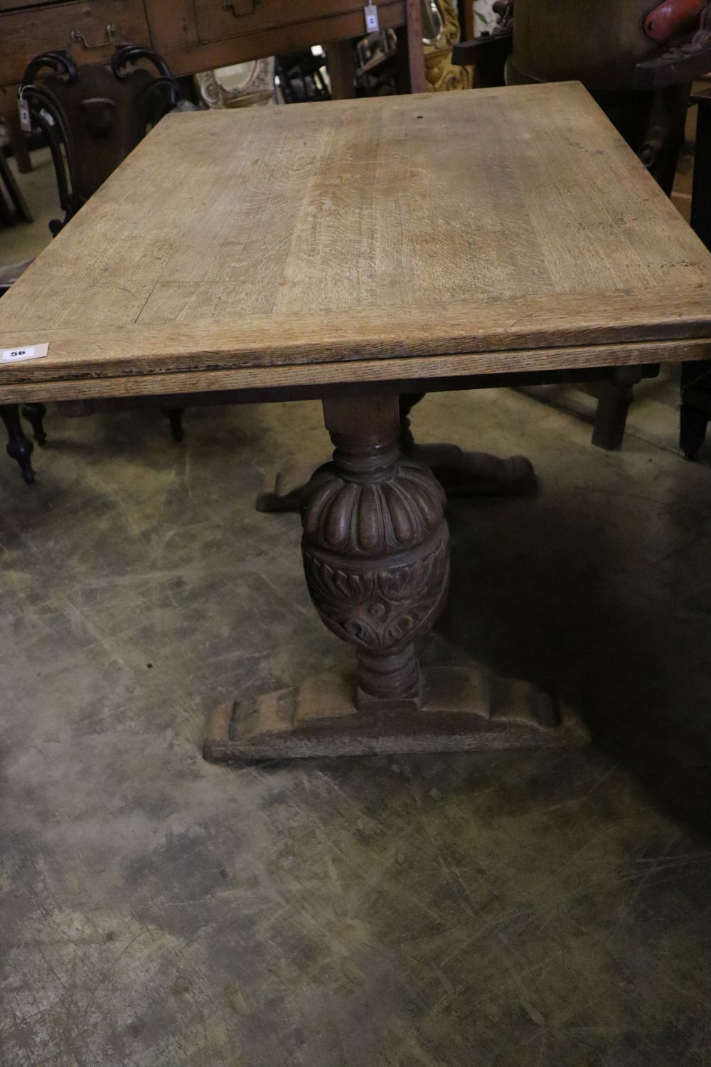 An Elizabethan style oak draw leaf extending dining table, 210cm extended width 80cm height 75cm